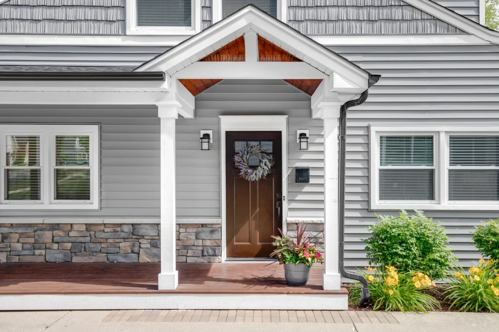 neutral grey vinyl siding exterior matching well with brown front exterior door