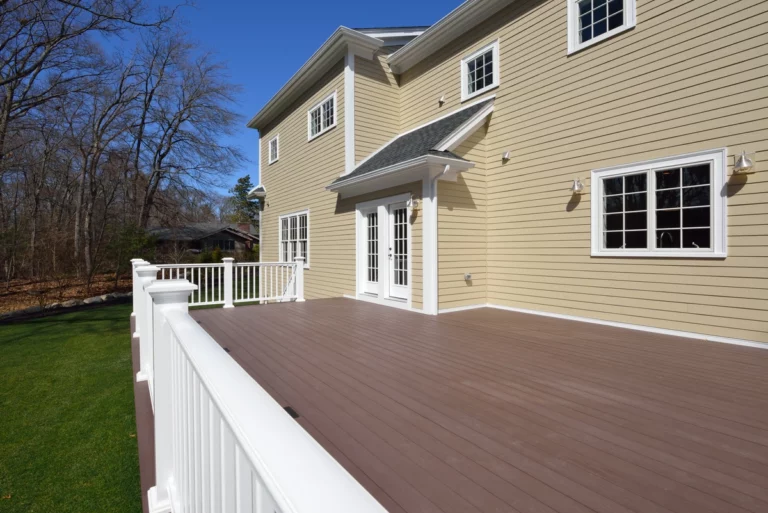 side view of home with new siding installed -siding cost
