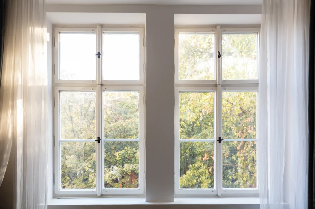 close up of white window frames and replacment windows