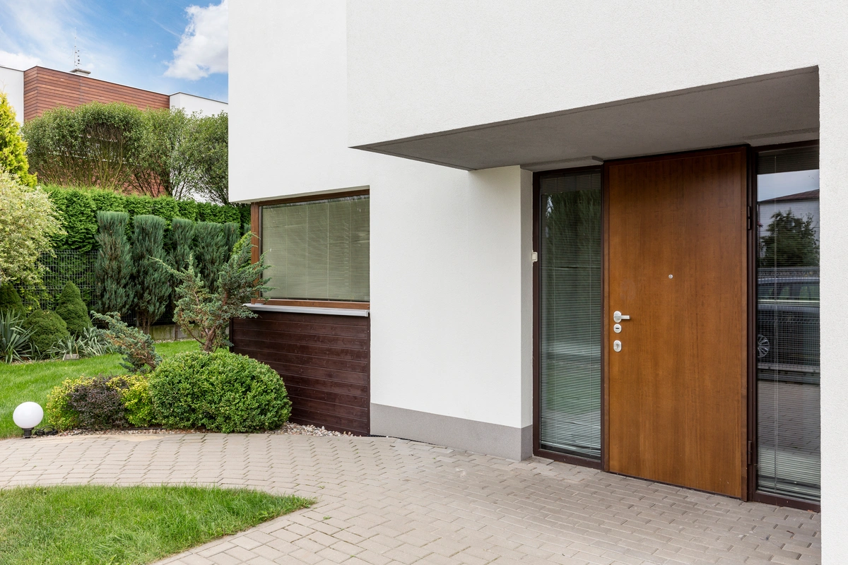 perform a door frame replacement large house entrance with wooden door