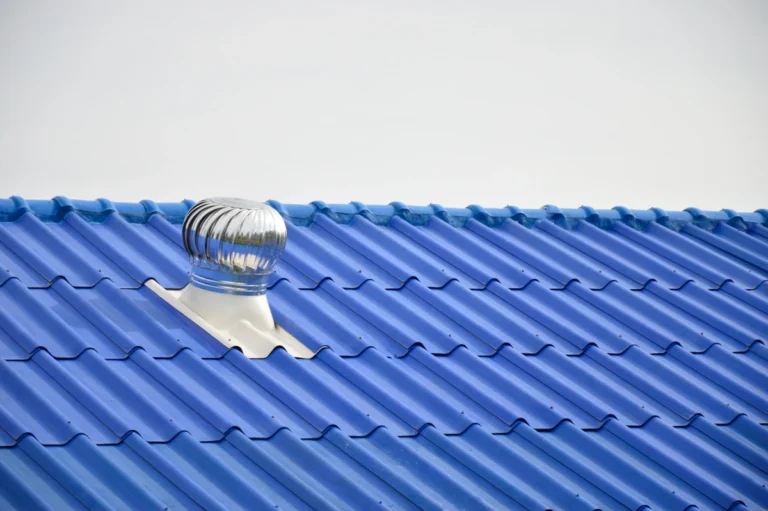 bright blue metal roof and turbine vent