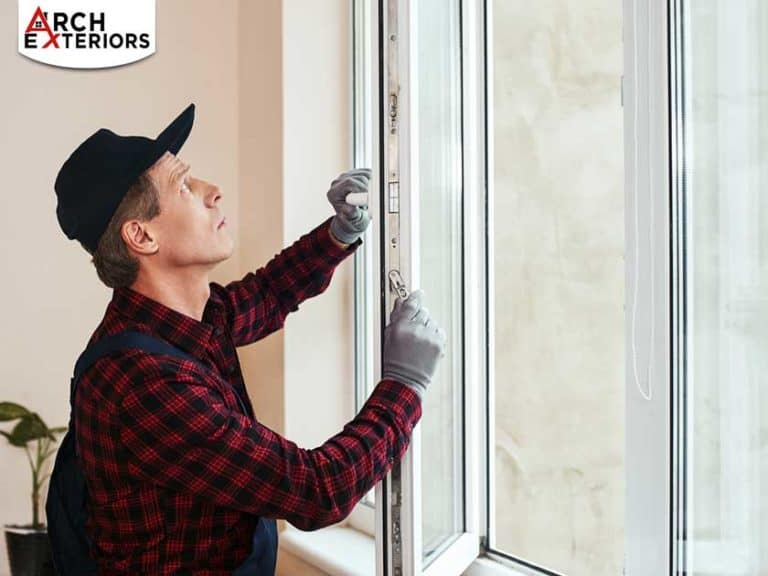male worker installing replacement windows in Arlington VA