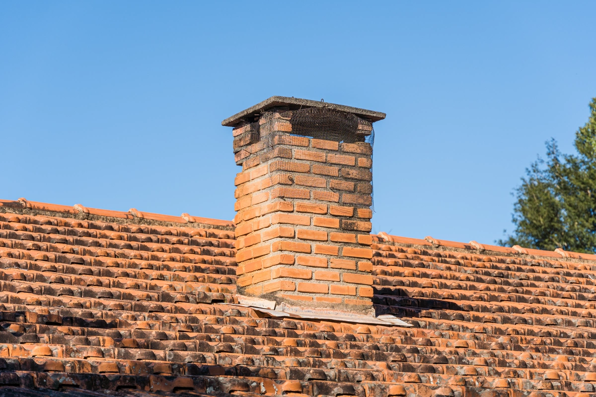 bad chimney flashing-older roof with a worn chimney