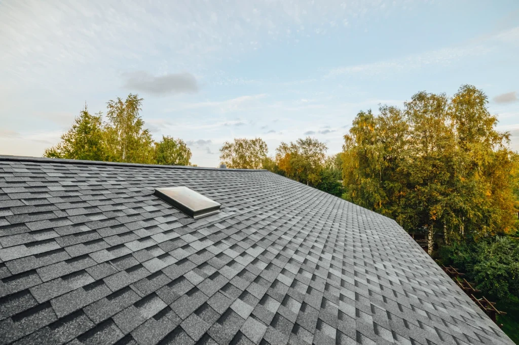 close up of new asphalt roof shingles installed on home