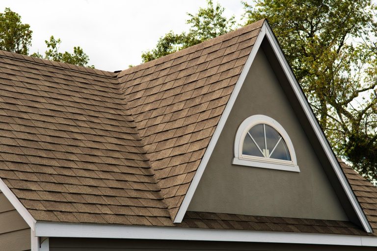 architectural shingles vs 3 tab-brown 3 tab shingles on a house