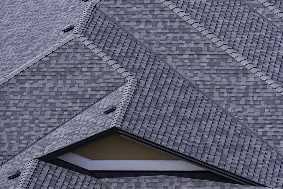 architectural shingles vs 3 tab-dark gray architectural shingles on a home