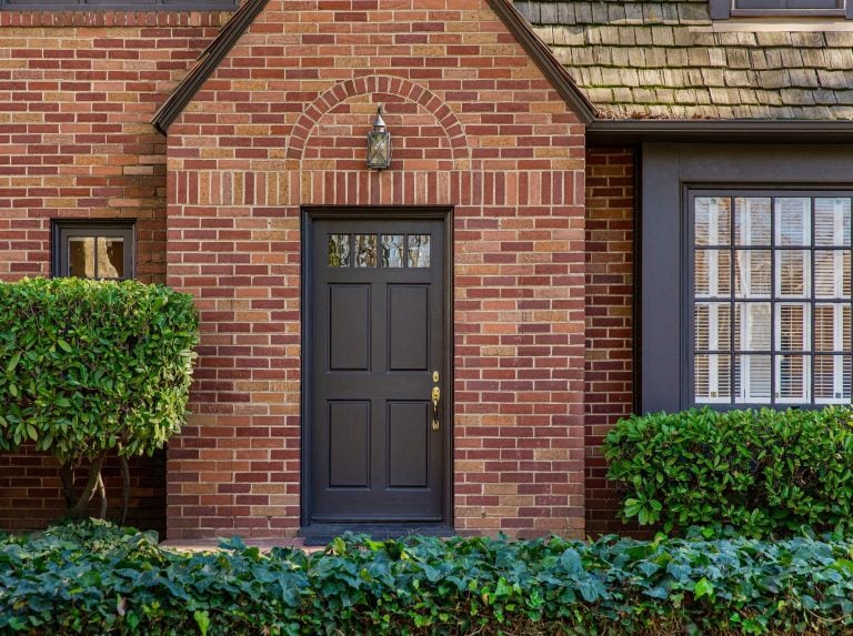 how to pick a front door color-brick house with a black front door