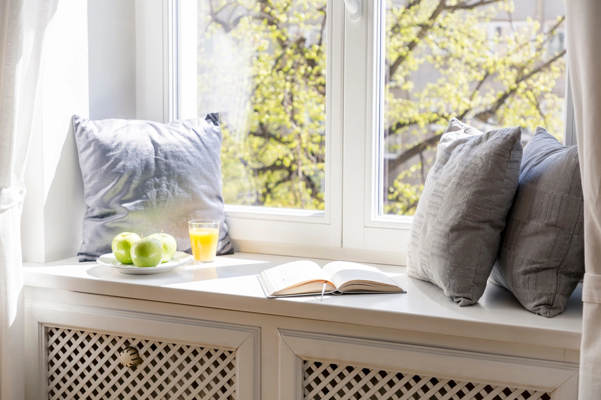 close up to windowsill with cushions