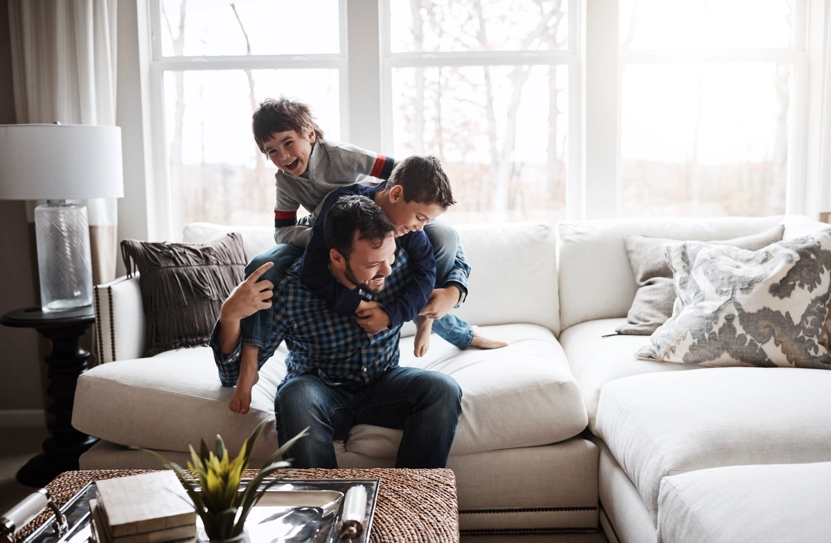 Father and kids playing together