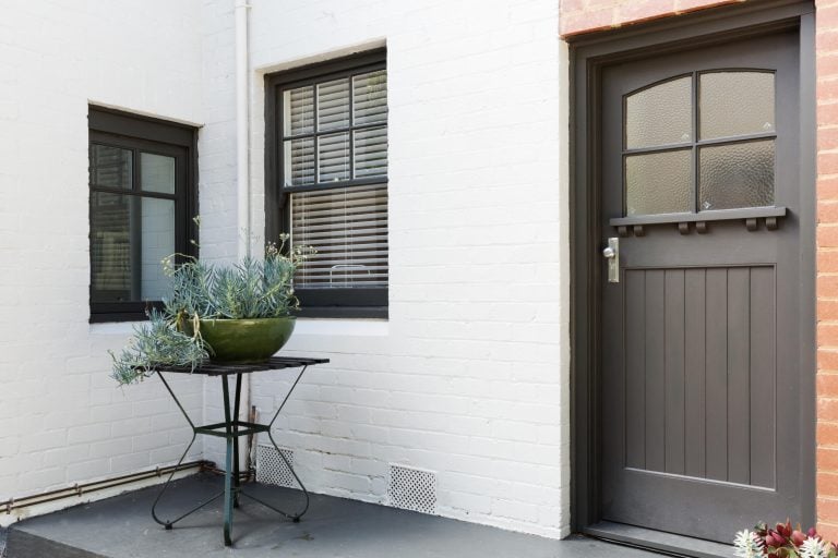 how to paint a fiberglass door-white brick home with a black front door