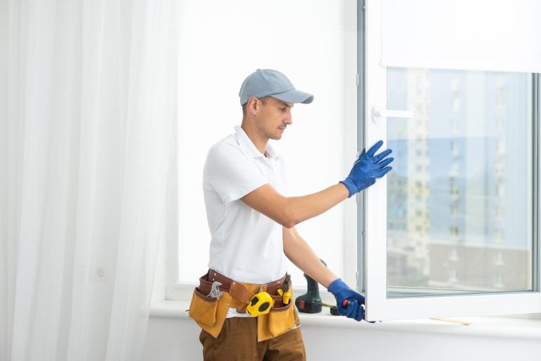 how to replace glass in a double pane window-technician replacing a window in a home