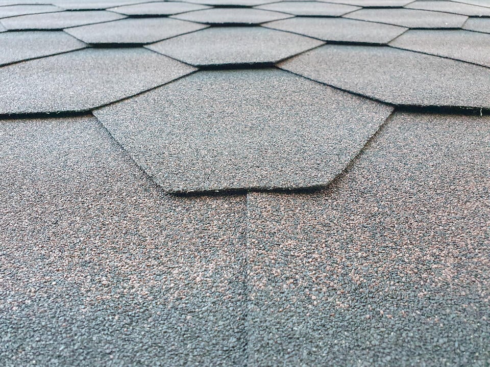 luxury asphalt shingles-close up view of hexagonal luxury shingles on a roof