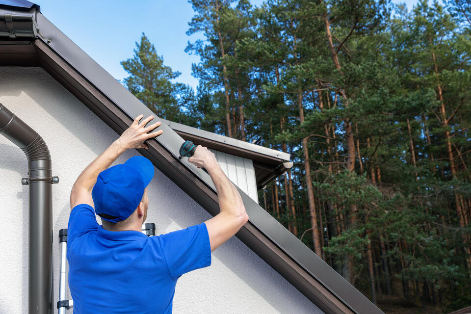 roof drip edge-close up of technician installing drip edge materials
