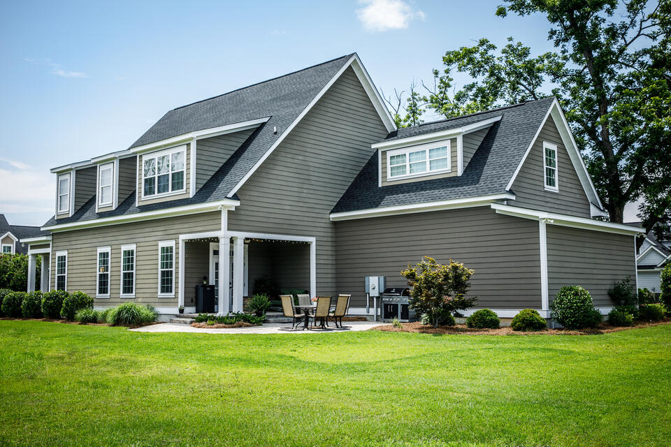 roof drip edge-gray sided house with white roof trim and drip edge