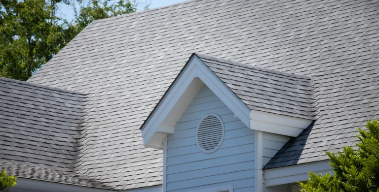 house roof with replaced missing shingles