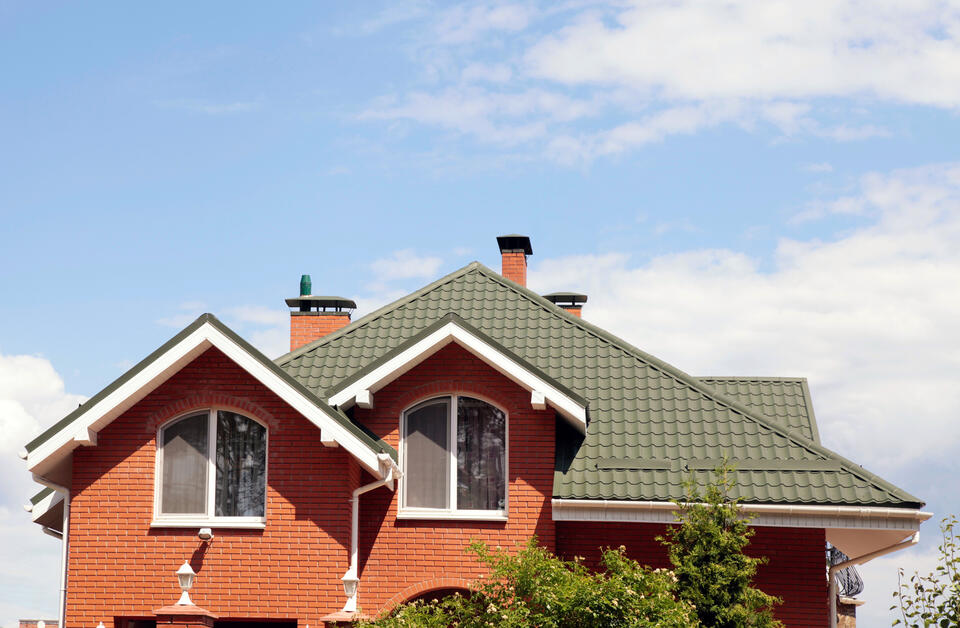house and roof color combinations-red brick house with green metal roofing