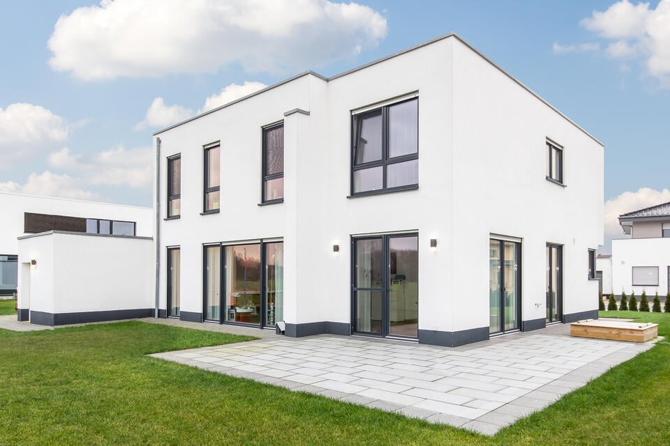 roof design-flat roof on a white residential home