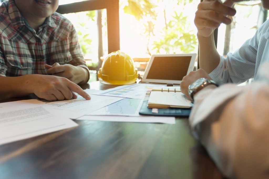 meeting to choose the right roofing contractor