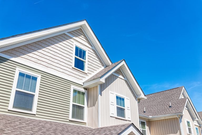 Construction building new modern apartment house with wooden exterior and nobody against blue sky in America