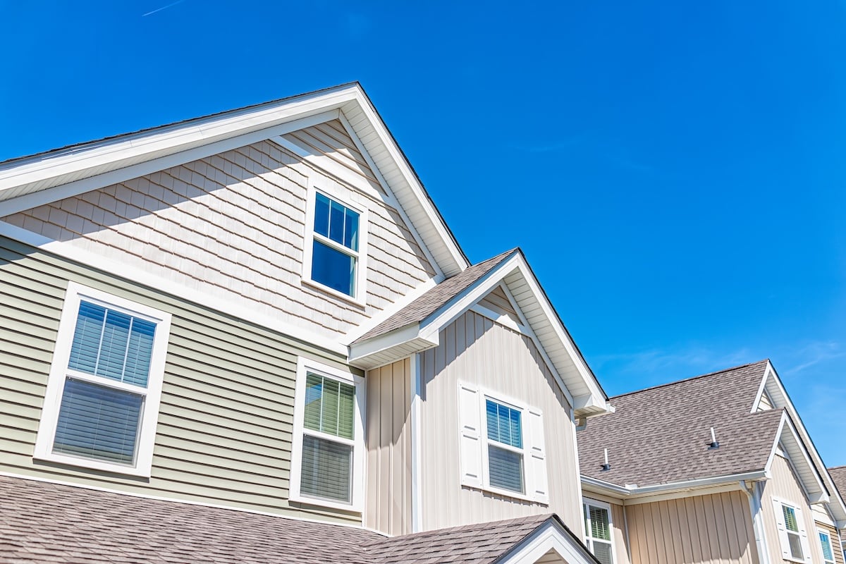 Construction building new modern apartment house with wooden exterior and nobody against blue sky in America