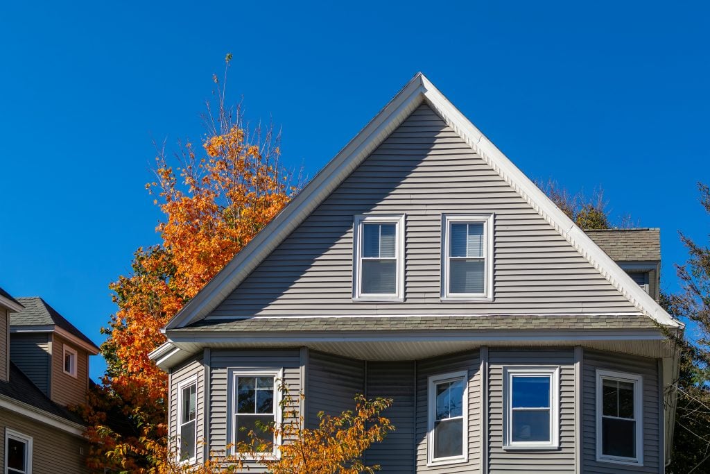 insulated vinyl siding Single family home facade, autumn day