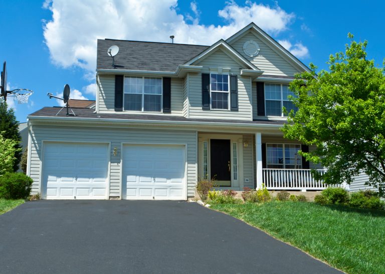 Single family house in suburban Maryland, United States. Two car garage, driveway and basketball hoop.