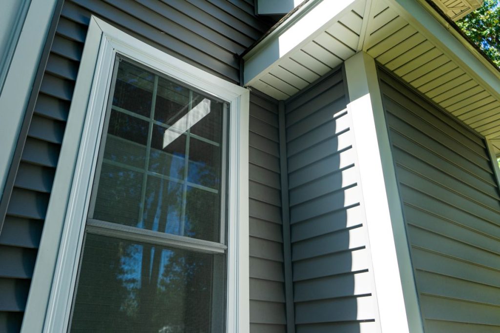 New vinyl siding and window treatments at a residential home