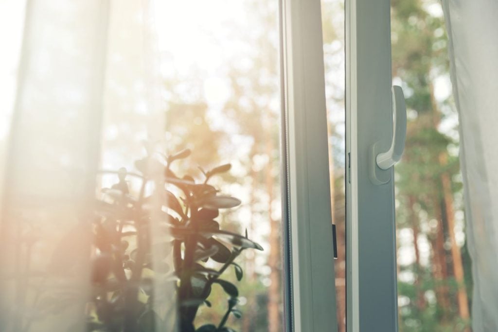 open window with sheer curtain