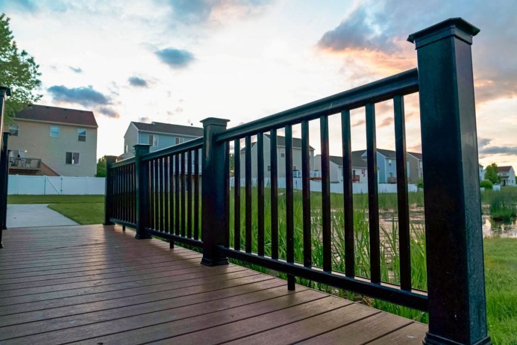 black and heavy deck railing old style wooden floor