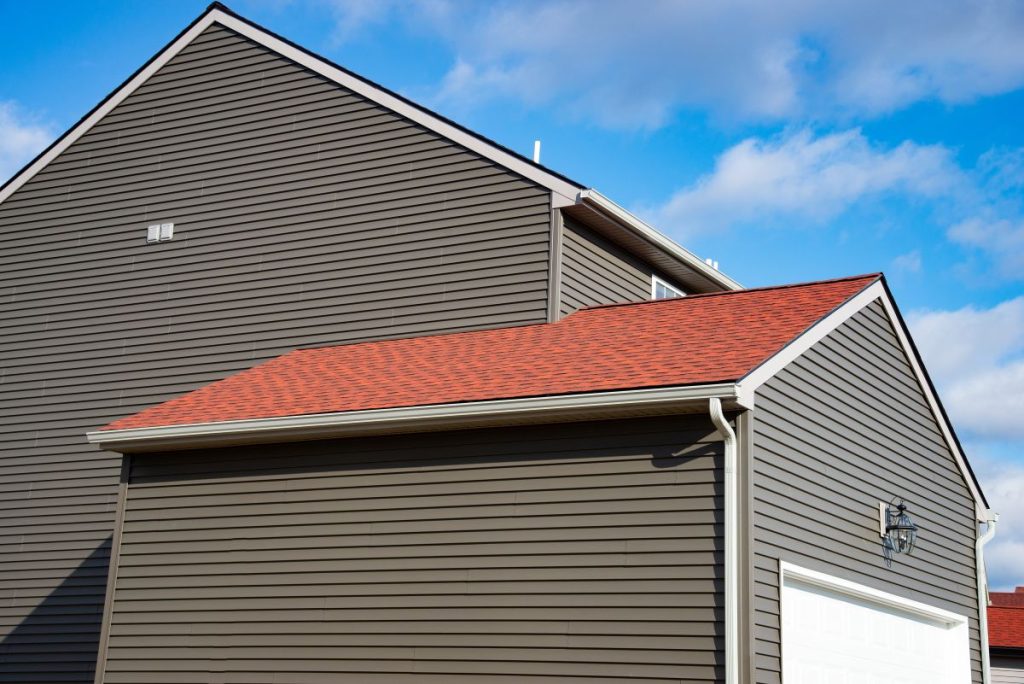 grey fiber cement siding brown shingles roof