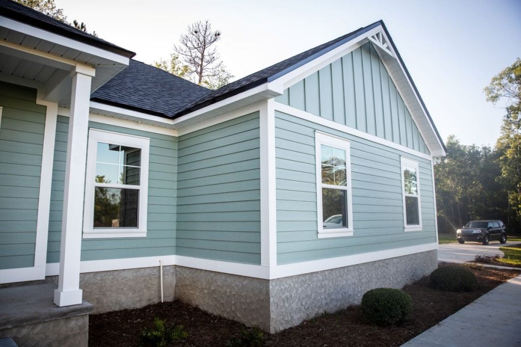 low maintenance siding blue house shingles roof