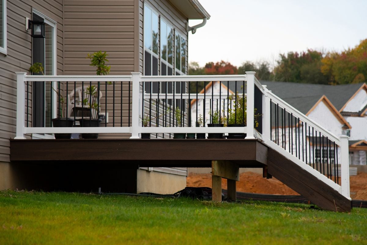 white and black deck railing family home