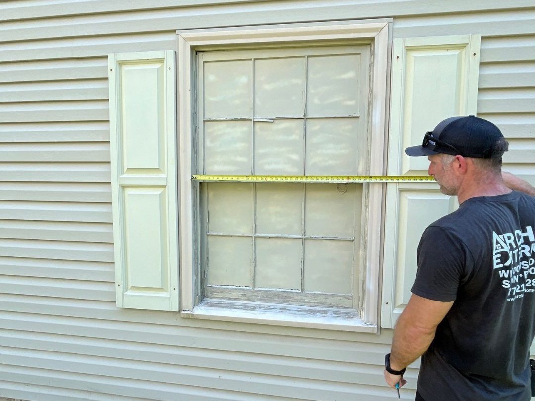 window installation hagerstown guy holding measuring tape