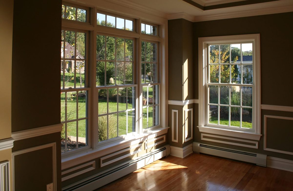 window replacement gaithersburg Sunny corner in living room with garden view through beautiful windows